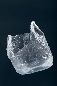 白色空塑料袋浮动在黑色的背景收集塑料浪费回收概念塑料污染和太许多塑料浪费复制空间的前
