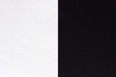 摘要黑色的和白色纸背景颜色是分离垂直纹理厚纸