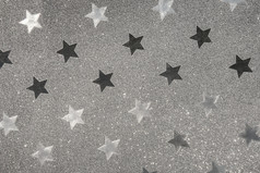 银包装纸闪烁的明星形状模式背景纹理银包装纸闪烁的明星形状模式背景纹理