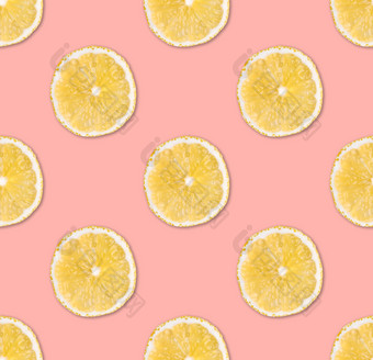 新鲜的黄色的柠檬片无缝的模式关闭柑橘类水果片柔和的粉红色的背景工作室摄影背景新鲜的黄色的柠檬片无缝的模式关闭工作室摄影