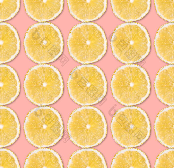 新鲜的黄色的柠檬片无缝的模式关闭柑橘类水果片柔和的粉红色的背景工作室摄影背景新鲜的黄色的柠檬片无缝的模式关闭工作室摄影