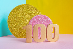 金数量五彩缤纷的blue-yellow-pink背景和两个闪亮的黄金和粉红色的圈快乐生日问候卡概念