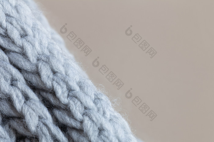 针织羊毛变形表面米色背景宏软灰色美利奴羊毛模式背景特写镜头秋天和冬天平躺斯堪的那维亚最小的风格水平