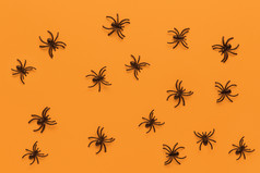 万圣节平躺模式从黑色的蜘蛛橙色背景最小的风格水平糖果概念