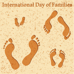 国际一天家庭概念家庭人父亲妈妈。女儿婴儿他们的的足迹的海滩国际一天家庭