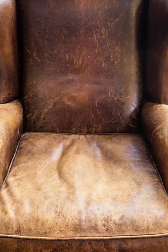 老皮革椅子特写镜头棕色（的）纹理复古的设计老皮革椅子特写镜头棕色（的）纹理复古的设计