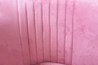 关闭粉红色的天鹅绒织物背景纹理软柔和的粉红色的纺织特写镜头关闭粉红色的天鹅绒织物背景纹理软柔和的粉红色的纺织