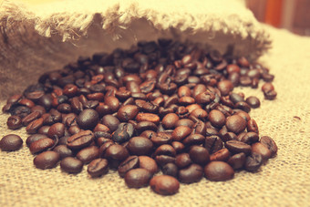 咖啡豆子老粗麻布背景咖啡豆子粗麻布背景