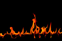 火火焰摘要艺术黑色的背景燃烧红色的热火花上升激烈的橙色发光的飞行粒子