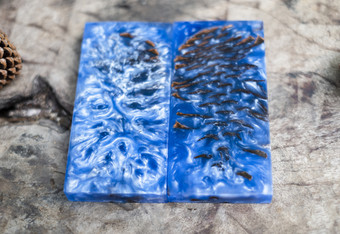 铸造环氧树脂树脂稳定松锥蓝色的摘要艺术背景