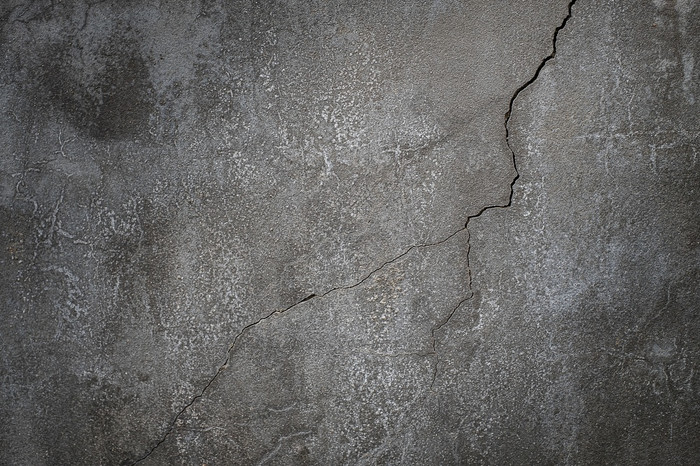 混凝土水泥墙与裂纹为设计和纹理背景
