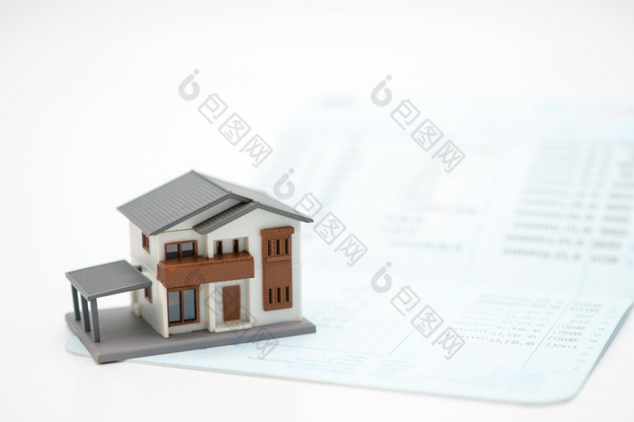 的房子模型放置银行笔记投资投资真正的房地产首页贷款使用背景业务概念和真正的房地产概念与复制空间为你的文本