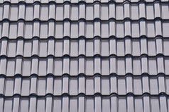 关闭集团灰色的瓷砖屋顶纹理灰色的背景