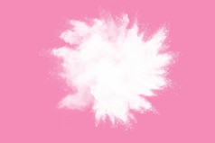白色粉爆炸粉红色的背景油漆胡里节