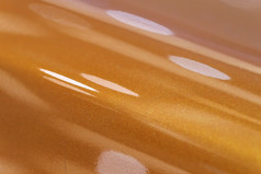 黄金橙色棕色（的）金属车油漆表面壁纸背景