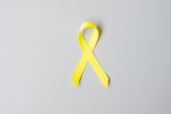 童年癌症肉瘤骨膀胱和自杀<strong>预防</strong>意识月黄金黄色的丝带为支持人生活和<strong>疾病</strong>孩子们医疗保健和世界癌症一天概念