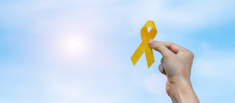 自杀预防肉瘤骨膀胱童年<strong>癌症</strong>意识月黄色的丝带为支持人生活和疾病孩子们医疗保健和<strong>世界癌症</strong>一天概念
