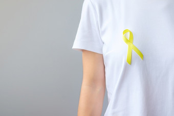 黄色的丝带为支持人生活和疾病9月自杀预防一天童年肉瘤和骨癌症意识月概念