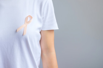 桃子丝带为9月子宫癌症意识月医疗保健和世界癌症一天概念