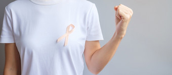 桃子丝带为9月子宫癌症意识月医疗保健和世界癌症一天概念