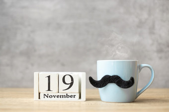 国际但一天与11月日历蓝色的咖啡杯<strong>茶</strong>杯子和黑色的胡子装饰表格快乐父亲一天和庆祝<strong>活动</strong>概念