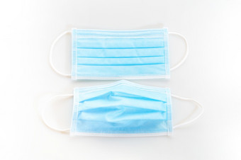 disposeable蓝色的卫生<strong>面具</strong>白色背景保护从病毒科维德污染