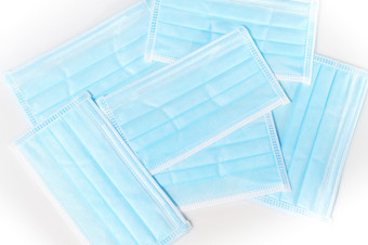 disposeable蓝色的卫生面具白色背景保护从病毒科维德污染