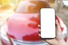 特写镜头女使用手持有智能手机模糊图片触摸摘要模糊头灯窗口红色的车户外背景
