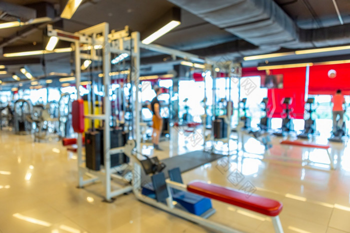 摘要模糊散焦现代健身房室内和健身健康俱乐部与体育锻炼设备健身中心室内背景