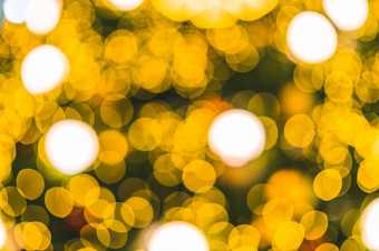 快乐x-mas黄色的色彩斑斓的光摘要圆形散景的光隧道圣诞节树背景装饰在圣诞节和新一年节日照明