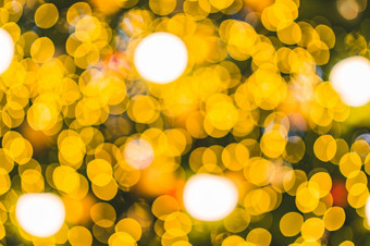 快乐x-mas黄色的色彩斑斓的光摘要圆形散景的光隧道圣诞节树背景装饰在圣诞节和新一年<strong>节日</strong>照明