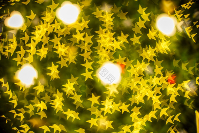 快乐x-mas黄色的色彩斑斓的光摘要明星散景的光隧道圣诞节树背景装饰在圣诞节和新一年节日照明