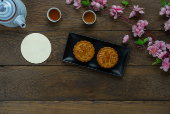 表格前视图空中图像装饰中国人月亮节日月球新一年背景conceptflat躺至关重要的餐集为咖啡打破甜蜜的蛋糕茶与开花棕色（的）木