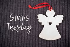 给周二全球一天慈善给后黑色的星期五购物一天慈善机构给帮助捐款和支持概念与文本消息标志和工艺木天使