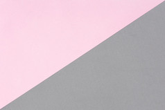 粉红色的纸和灰色泡沫表与对角纹理背景模板为为文本画