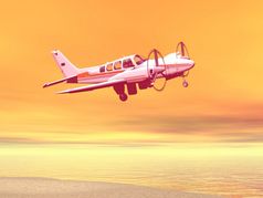 小飞机飞行在海滩和海洋橙色背景飞机在海洋海滩