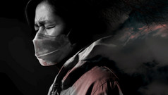 强调亚洲人穿外科手术面具精神健康在冠状病毒概念黑暗语气双曝光技术