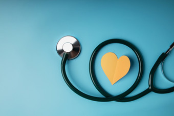 健康哪概念国际世界心一天纸减少心形状与听诊器躺蓝色的背景生活爱和哪前视图