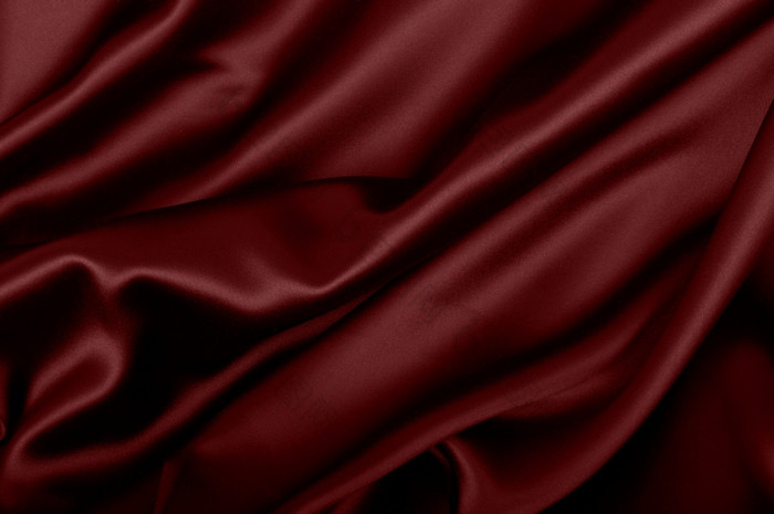 红色的纹理黑暗波浪光滑的丝绸布料