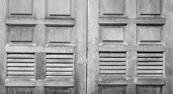 关闭老木窗口古董灰色的木窗口纹理背景灰色的木窗口装饰房子传统的风格经典体系结构首页设计