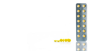 黄色的电影涂层平板电脑药片泡包和集团轮黄色的平板电脑药片白色背景药店水平网络横幅处方药物药店产品健康哪主题