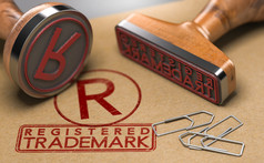 插图两个橡胶邮票与的文本注册商标和的象征在棕色（的）纸背景商标登记概念注册商标概念