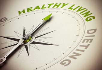 指南针与针指出的主要绿色词和模糊效果概念为健康的生活与节食健康的生活风格饮食概念