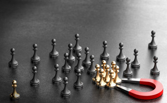 马蹄磁铁吸引金棋子在黑色的背景概念入站招聘和吸引人才的企业插图入站招聘吸引新人才