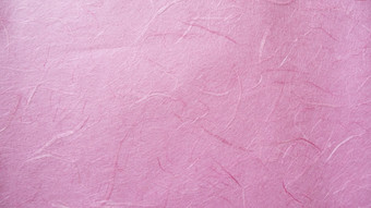 粉红色的桑纸纹理背景手工制作的纸水平与独特的设计纸软自然纸风格为审美有创意的设计
