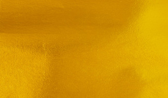 黄金箔纸纹理背景闪亮的奢侈品箔水平与独特的设计纸软自然风格为审美有创意的设计