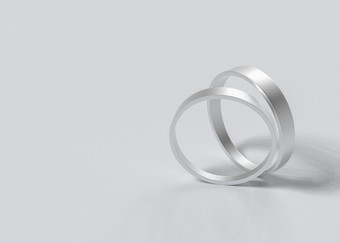 呈现一对简单的婚礼环灰色的背景