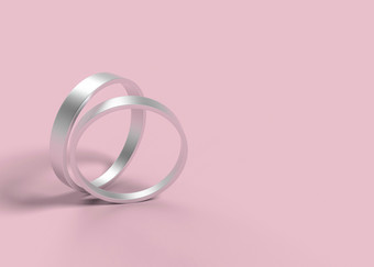 呈现简单的设计银婚礼环一对粉红色的<strong>背景</strong>