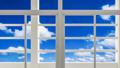 透明的玻璃窗口和遮阳伞压条与模糊白色云蓝色的天空背景视图从内部建筑