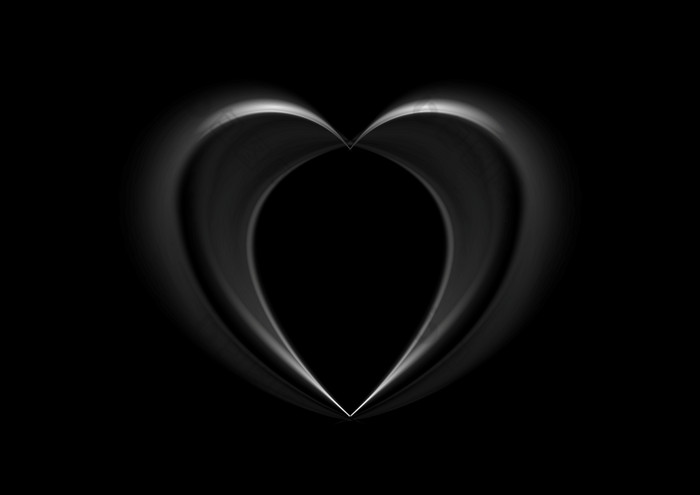 光滑的丝绸黑色的心背景光滑的丝绸黑色的心背景情人节一天设计
